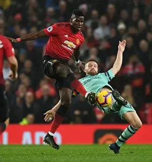 Manchester United V Arsenal 2018-19 Prints: Mustafi vs Pogba: A Footballing Battle in the Premier League Clash between Manchester United and Arsenal FC