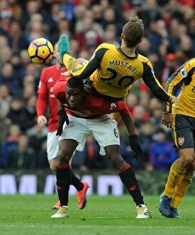 Images Dated 19th November 2016: Mustafi vs. Pogba: A Premier League Battle at Old Trafford - Manchester United vs. Arsenal, 2016-17