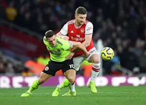Mustafi vs. Sharp: A Premier League Battle - Arsenal vs. Sheffield United's Intense Clash