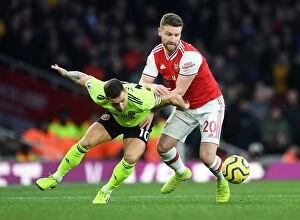 Images Dated 18th January 2020: Mustafi vs. Sharp: A Tense Battle at the Emirates