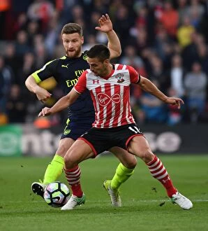 Images Dated 10th May 2017: Mustafi vs. Tadic: Intense Clash Between Southampton and Arsenal Players