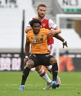 Wolverhampton Wanderers V Arsenal 2019-20 Prints: Mustafi vs Traore: Intense Clash Between Wolverhampton and Arsenal in Premier League (2019-20)