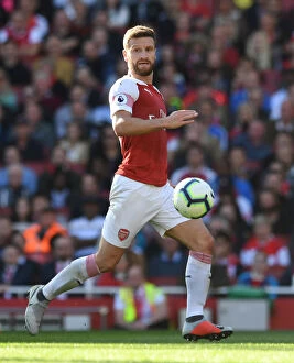 Arsenal v Watford 2018-19 Collection: Mustafi's Determination: Arsenal's Key Player in the Battle Against Watford (2018-19)