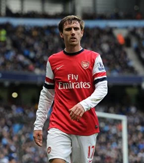 Manchester City Collection: Nacho Monreal in Action: Manchester City vs. Arsenal (2013-14)