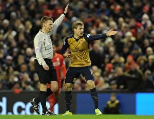 Images Dated 13th January 2016: Nacho Monreal Argues with Referee during Intense Liverpool vs