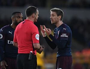 Images Dated 24th April 2019: Nacho Monreal Contests Referees Call in Intense Wolverhampton Wanderers vs