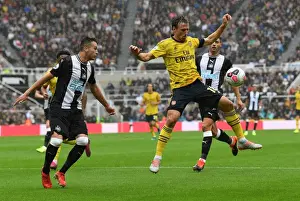 Nacho Monreal Faces Pressure from Javier Manquillo in Newcastle United vs Arsenal FC Premier League Clash