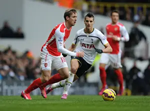 Tottenham Hotspur V Arsenal 2014-15 Prints: Nacho Monreal Outmaneuvers Erik Lamela: A Battle in the Premier League Clash Between Tottenham and Arsenal
