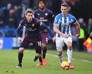 Nacho Monreal vs. Jonathan Hogg: Intense Battle in Huddersfield Town vs. Arsenal FC Premier League Clash