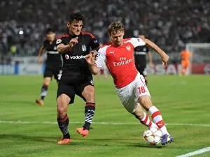 Besiktas V Arsenal 2014-15 Prints: Nacho Monreal vs Mustafa Pektemek: Battle in Istanbul - Arsenal vs Besiktas