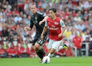 Arsenal v Liverpool 2011-2012 Collection: Nasri vs. Adam: Liverpool's Dominance over Arsenal in the 2011-2012 Barclays Premier League