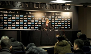 Newcastle United v Arsenal 2013-14 Collection: NEWCASTLE UPON TYNE, ENGLAND - DECEMBER 29: Arsenal manager Arsene Wenger holds