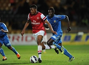 Arsenal U19 V Olympique De Marseille - NextGen 2012-13 Prints: NextGen Stars Clash: Akpom vs. Dubois, Arsenal U19 vs. Olympique de Marseille