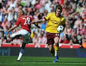 Stoke City v Arsenal 2010-11 Collection: Nicklas Bendtner (Arsenal) Andy Wilkinson (Stoke). Stoke City 3: 1 Arsenal