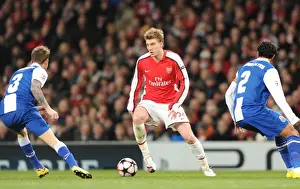 Arsenal V FC Porto 2009-10 Prints: Nicklas Bendtner (Arsenal) Bruno Alves and Raul Meireles (Porto). Arsenal 5: 0 FC Porto