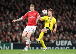 Arsenal v Barcelona 2009-10 Collection: Nicklas Bendtner (Arsenal) Carlos Puyol (Barcelona). Arsenal 2: 2 Barcelona