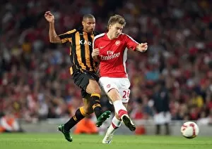 Arsenal v Hull City 2008-9 Collection: Nicklas Bendtner (Arsenal) Daniel Cousin (Hull)