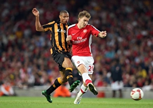 Arsenal v Hull City 2008-9 Collection: Nicklas Bendtner (Arsenal) Daniel Cousin (Hull)