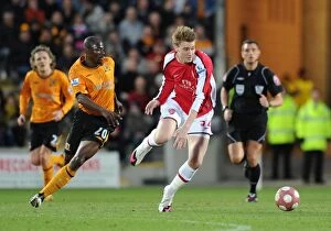 Images Dated 13th March 2010: Nicklas Bendtner (Arsenal) George Boateng (Hull). Hull City 1: 2 Arsenal