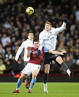 Images Dated 27th January 2010: Nicklas Bendtner (Arsenal) James Milner (Villa). Aston Villa 0: 0 Arsenal