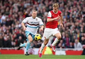 Images Dated 30th October 2010: Nicklas Bendtner (Arsenal) Lars Jacobsen (West Ham). Arsenal 1: 0 West Ham United