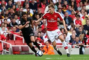 Arsenal v Athletico Madrid 2009-10 Collection: Nicklas Bendtner (Arsenal) Raul Garcia (Atletico)