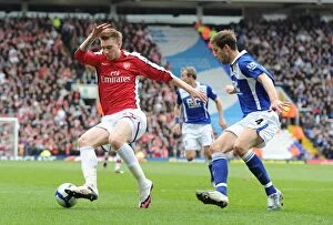 Birmingham City v Arsenal 2009-10 Collection: Nicklas Bendtner (Arsenal) Roger Johnson (Birmingham). Birmingham City 1: 1 Arsenal