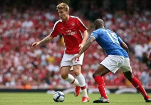 Nicklas Bendtner (Arsenal) Sylvain Distin (Portsmouth)