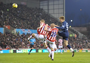 Nicklas Bendtner heads past Ryan Shawcross and Andy Wilkinson to score the 1st Arsenal Nicklas Bendtner heads past Ryan Shawcross and Andy Wilkinson to score the 1st Arsenal
