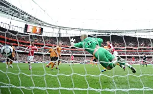 Nicklas Bendtner heads past Wolves goalkeeper Marcus Hahnemann to score the Arsenal goal