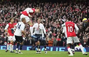 Images Dated 25th December 2007: Nicklas Bendtner scores Arsenals 2nd goal as Teemu Tainio (Spurs) looks on