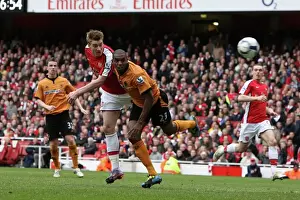 Nicklas Bendtner scores Arsenals goal under pressure from Ronald Zubar (Wolves)