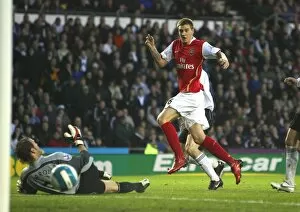Nicklas Bendtner shoots past Derby goalkeeper Roy Carroll to score the 1st Arsenal goal