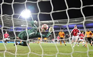 Nicklas Bendtner shoots past Hull goalkeeper Boaz Myhill to score the 2nd Arsenal goal