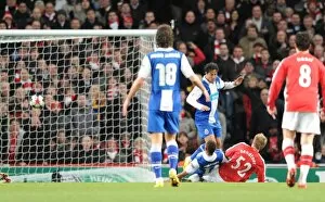 Arsenal v FC Porto 2009-10 Collection: Nicklas Bendtner shoots past Porto goalkeeper Helton to score the 1st Arsenal goal