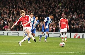 Arsenal v FC Porto 2009-10 Collection: Nicklas Bendtner shoots past Porto goalkeeper Helton to score his 3rd
