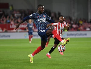 Images Dated 14th August 2021: Nicolas Pepe in Action: Brentford vs Arsenal, Premier League 2021-22