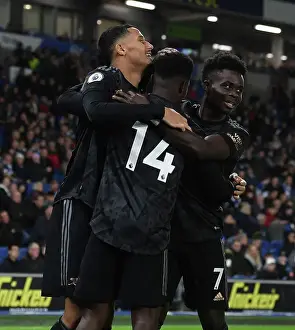 Nketiah Hat-trick: Saliba and Saka's Jubilant Celebrations as Arsenal Triumph Over Brighton