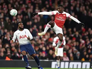 Arsenal V Tottenham Hotspur Carabao Cup 2018-19 Prints: Nketiah Soars Above Rose: Arsenal's Carabao Cup Triumph over Tottenham