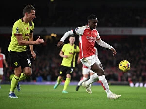 Images Dated 11th November 2023: Nketiah vs Berge: A Battle of Strengths in Arsenal's Premier League Clash Against Burnley (2023-24)