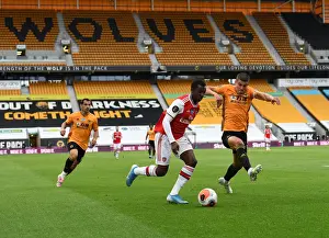 Wolverhampton Wanderers V Arsenal 2019-20 Prints: Nketiah vs. Coady: Intense Battle at Molineux - Wolverhampton Wanderers vs