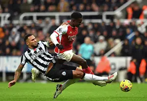 Nketiah vs Lascelles: Intense Battle in Newcastle United vs Arsenal FC, Premier League 2023-24