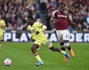 West Ham United V Arsenal 2021-22 Prints: Nketiah vs. Zouma: A Battle of Intense Determination in Arsenal's Clash with West Ham