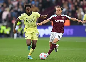 West Ham United V Arsenal 2021-22 Prints: Nuno Tavares vs Mark Noble: Intense Battle in West Ham United vs Arsenal Premier League Clash