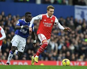 Everton v Arsenal 2022-23 Collection: Odegaard Outsmarts Gueye: Intense On-Pitch Battle from Arsenal's Triumph over Everton