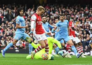 Arsenal v Manchester City 2021-22 Collection: Odegaard vs. Ederson: A Premier League Showdown at Emirates Stadium - Arsenal vs. Manchester City