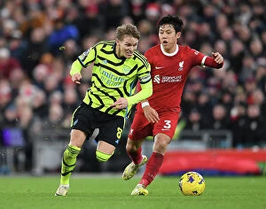 Liverpool v Arsenal 2023-24 Collection: Odegaard vs. Endo: Battle at Anfield - Liverpool vs. Arsenal, Premier League 2023-24