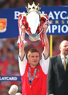 Oleg Luzhny lifts the F. A. Barclaycard Premiership Trophy