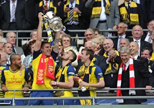 Olivier Giroud with Aaron Ramsey, Nacho Monreal and Arsenal Manager Arsene Wenger