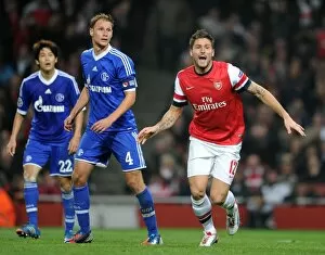 Images Dated 24th October 2012: Olivier Giroud (Arsenal) Benedikt Howedes (Schalke). Arsenal 0: 2 Schalke 04